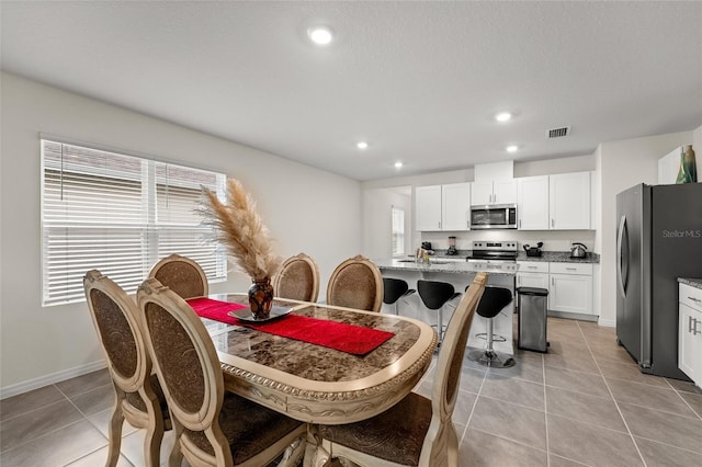 1792 Bull Hill Rd, Kissimmee, FL 34744 - dining space with light tile patterned flooring and recessed lighting