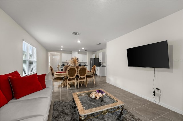 1792 Bull Hill Rd, Kissimmee, FL 34744 - living room featuring dark tile patterned floors and recessed lighting