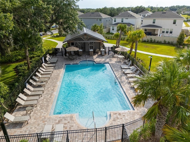 1792 Bull Hill Rd, Kissimmee, FL 34744 - community pool featuring a patio area and a residential view