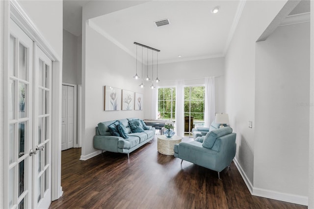 9285 Wickham Way, Orlando, FL 32836 - living area with dark wood-style flooring, ornamental molding, and french doors