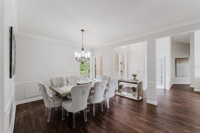 9285 Wickham Way, Orlando, FL 32836 - dining area featuring a chandelier, dark wood finished floors, ornamental molding, and a wainscoted wall