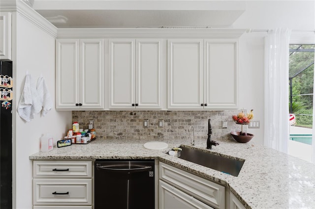 9285 Wickham Way, Orlando, FL 32836 - kitchen with dishwasher, white cabinets, and backsplash