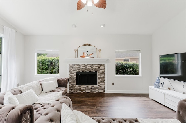 9285 Wickham Way, Orlando, FL 32836 - living room with healthy amount of natural light, a ceiling fan, dark wood-type flooring, and a fireplace