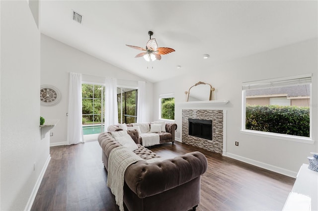 9285 Wickham Way, Orlando, FL 32836 - living area with healthy amount of natural light, lofted ceiling, wood finished floors, a ceiling fan, and a fireplace