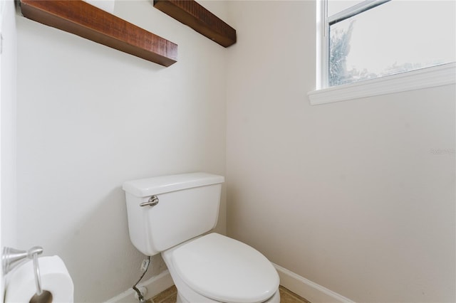 9285 Wickham Way, Orlando, FL 32836 - half bathroom with baseboards and toilet
