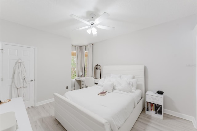 9285 Wickham Way, Orlando, FL 32836 - bedroom with light wood-style floors and ceiling fan