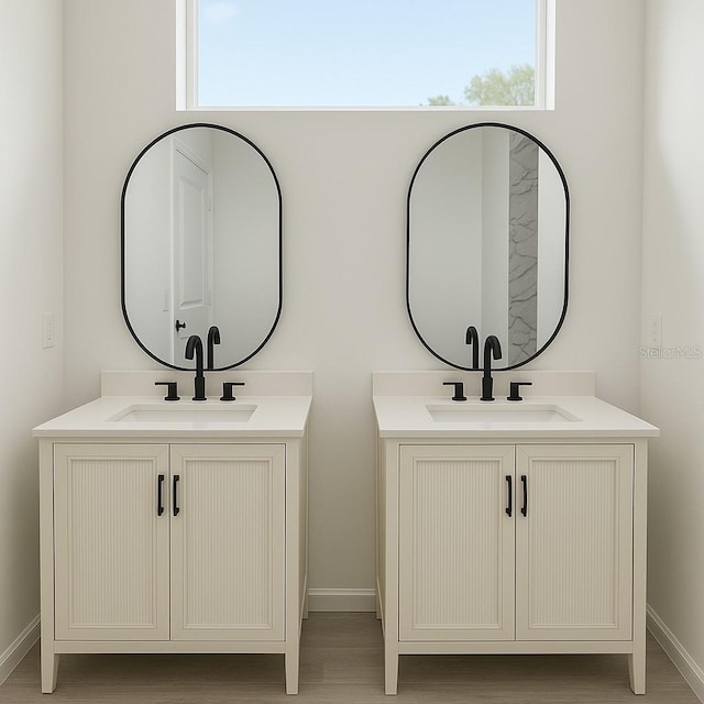 1309 Hillsborough Ln, Kissimmee, FL 34759 - bathroom with two vanities and wood finished floors