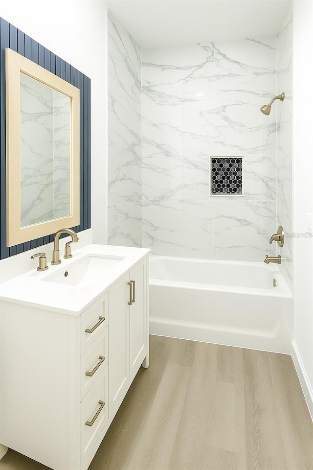 1309 Hillsborough Ln, Kissimmee, FL 34759 - bathroom with vanity, washtub / shower combination, and wood finished floors