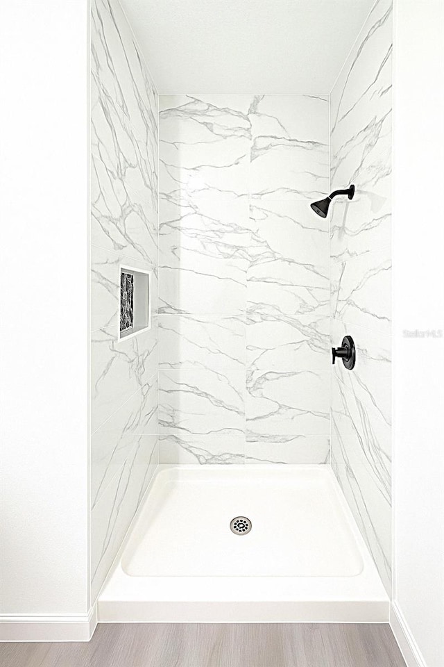 1309 Hillsborough Ln, Kissimmee, FL 34759 - bathroom featuring a stall shower and wood finished floors