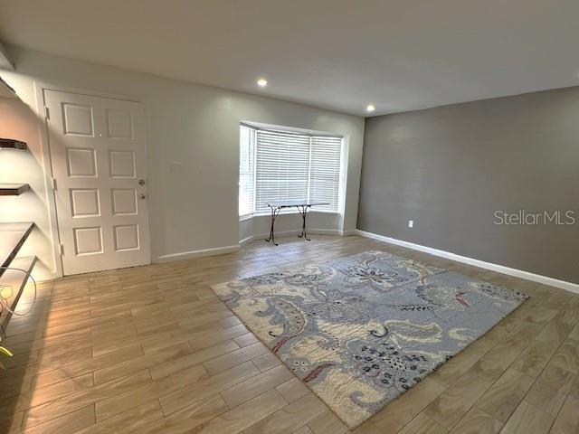 9148 Oakwood Dr, Lake Wales, FL 33898 - entryway with wood finished floors and recessed lighting