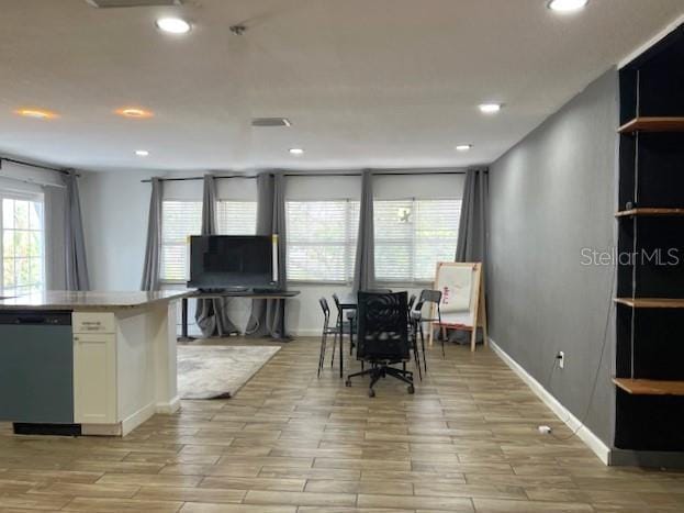 9148 Oakwood Dr, Lake Wales, FL 33898 - dining room featuring plenty of natural light, recessed lighting, and light wood-type flooring