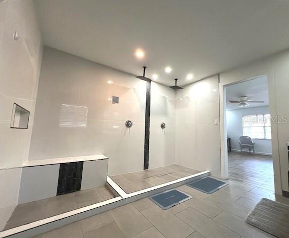 9148 Oakwood Dr, Lake Wales, FL 33898 - bathroom with tiled shower, recessed lighting, and a ceiling fan
