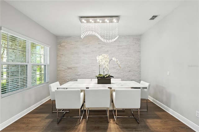 13924 Jomatt Loop, Winter Garden, FL 34787 - dining room with a chandelier and dark wood-style flooring