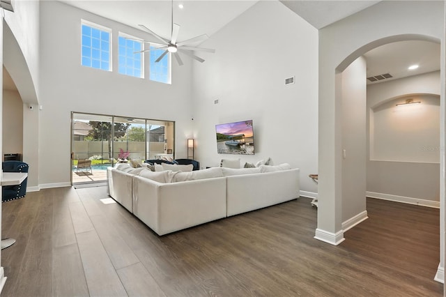 13924 Jomatt Loop, Winter Garden, FL 34787 - living room with arched walkways, ceiling fan, dark wood finished floors, a high ceiling, and recessed lighting