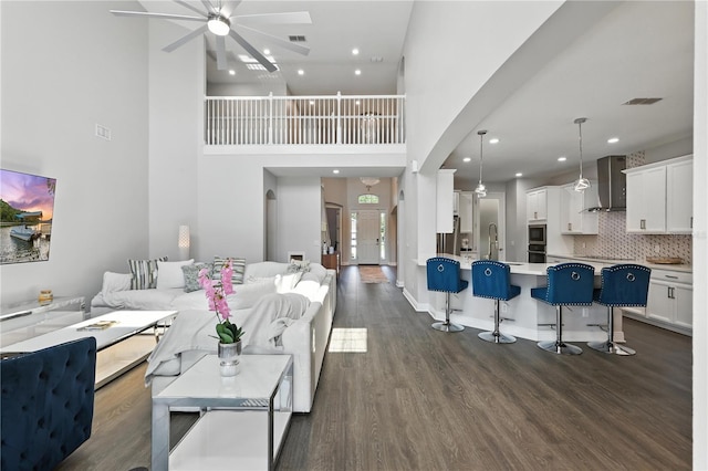 13924 Jomatt Loop, Winter Garden, FL 34787 - living area featuring a ceiling fan, dark wood-style floors, a high ceiling, and recessed lighting