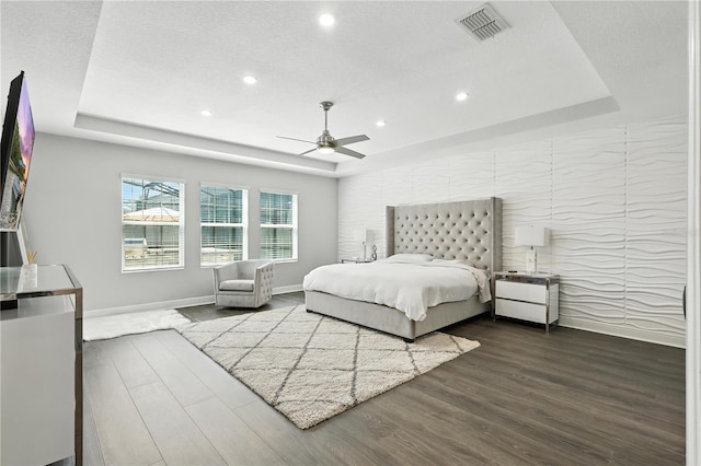 13924 Jomatt Loop, Winter Garden, FL 34787 - bedroom with a tray ceiling, dark wood-style floors, recessed lighting, and ceiling fan