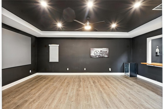 13924 Jomatt Loop, Winter Garden, FL 34787 - empty room with a raised ceiling, wood finished floors, and a ceiling fan