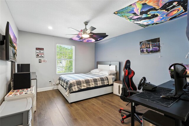 13924 Jomatt Loop, Winter Garden, FL 34787 - bedroom with wood finished floors, a desk, ceiling fan, and recessed lighting
