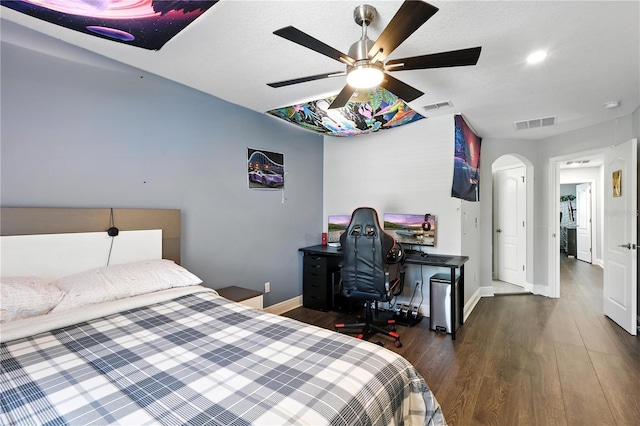 13924 Jomatt Loop, Winter Garden, FL 34787 - bedroom with wood finished floors, arched walkways, and ceiling fan