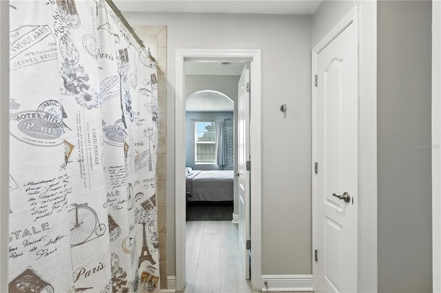 13924 Jomatt Loop, Winter Garden, FL 34787 - hall with arched walkways and wood finished floors