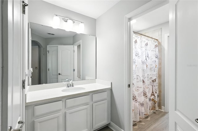 13924 Jomatt Loop, Winter Garden, FL 34787 - bathroom featuring vanity, wood finished floors, and a shower with shower curtain