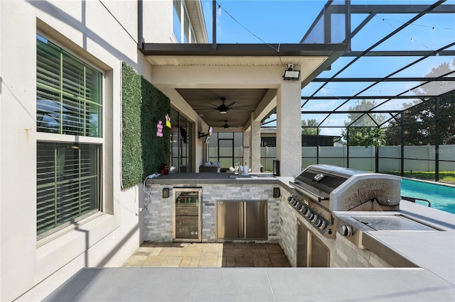 13924 Jomatt Loop, Winter Garden, FL 34787 - view of patio / terrace with area for grilling, wine cooler, ceiling fan, and glass enclosure