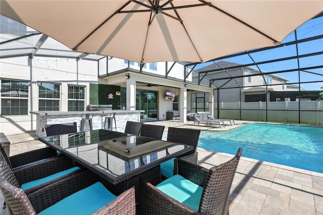13924 Jomatt Loop, Winter Garden, FL 34787 - view of swimming pool featuring a patio area, a ceiling fan, outdoor dining space, and a lanai