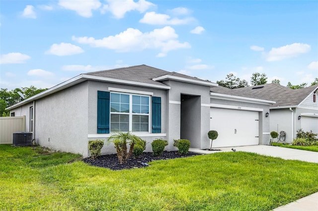 1351 Fox Squirrel Dr, Davenport, FL 33897 - view of front of home featuring an attached garage, stucco siding, driveway, and roof with shingles