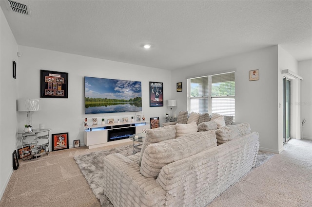 1351 Fox Squirrel Dr, Davenport, FL 33897 - living area featuring light carpet and a textured ceiling