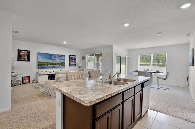 1351 Fox Squirrel Dr, Davenport, FL 33897 - kitchen featuring light colored carpet, stainless steel dishwasher, recessed lighting, dark brown cabinets, and light countertops
