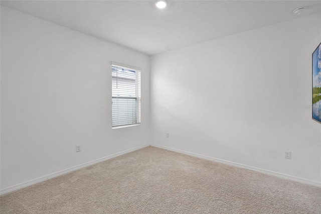 1351 Fox Squirrel Dr, Davenport, FL 33897 - empty room with light carpet, a smoke detector, and recessed lighting