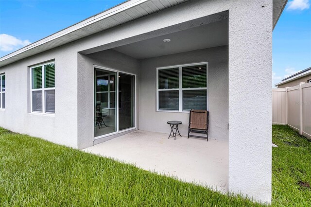 1351 Fox Squirrel Dr, Davenport, FL 33897 - rear view of property with a patio and stucco siding