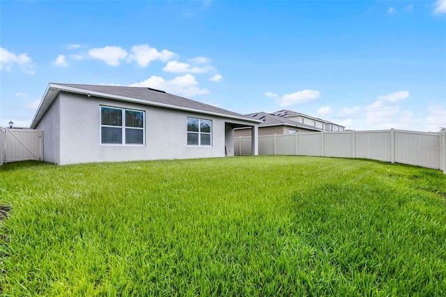 1351 Fox Squirrel Dr, Davenport, FL 33897 - back of property featuring a fenced backyard and stucco siding