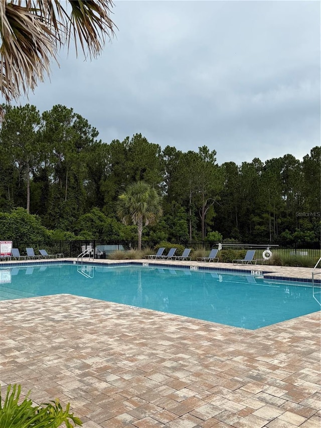 1351 Fox Squirrel Dr, Davenport, FL 33897 - community pool with a patio
