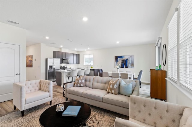 85 Las Casitas Blvd, Palm Coast, FL 32137 - living room with light wood-type flooring and recessed lighting