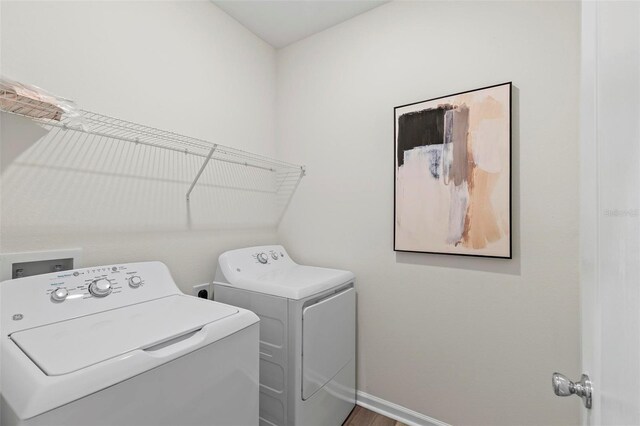 85 Las Casitas Blvd, Palm Coast, FL 32137 - washroom with washer and clothes dryer and baseboards