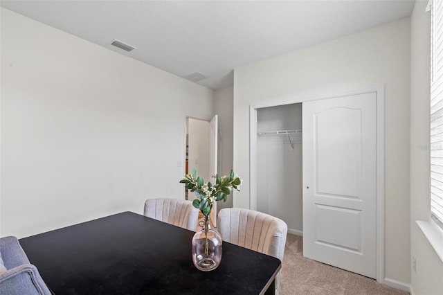 85 Las Casitas Blvd, Palm Coast, FL 32137 - dining room featuring light colored carpet and baseboards
