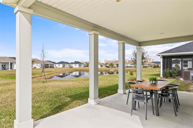 85 Las Casitas Blvd, Palm Coast, FL 32137 - view of patio with a water view, a residential view, and outdoor dining space