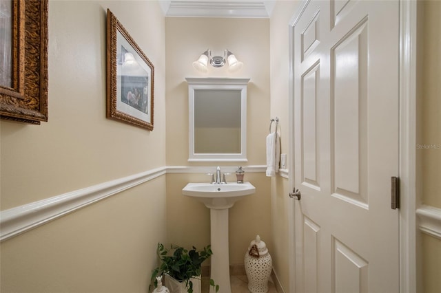 4709 Fox St, Orlando, FL 32814 - half bathroom with a sink and crown molding