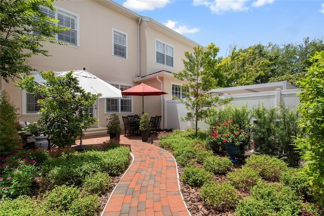4709 Fox St, Orlando, FL 32814 - rear view of house with stucco siding and a patio area