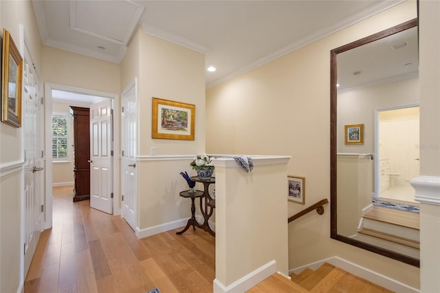 4709 Fox St, Orlando, FL 32814 - corridor with an upstairs landing, light wood-style floors, ornamental molding, and recessed lighting