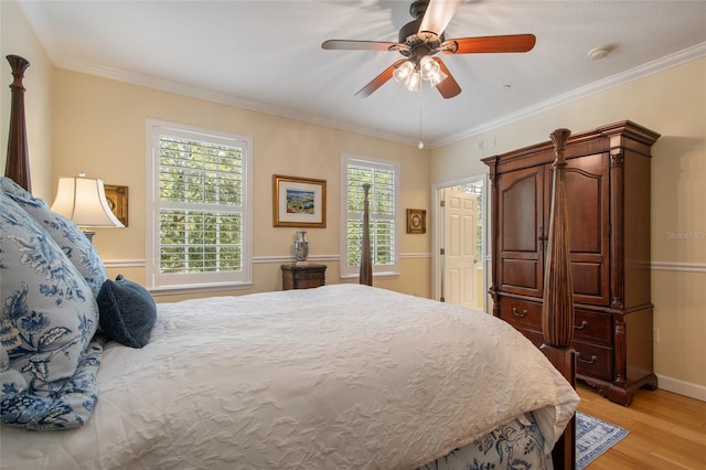 4709 Fox St, Orlando, FL 32814 - bedroom with light wood finished floors, ornamental molding, and a ceiling fan