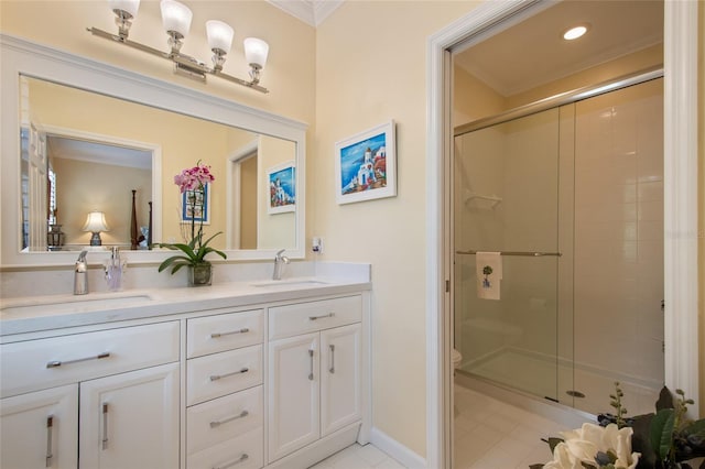 4709 Fox St, Orlando, FL 32814 - full bath with ornamental molding, double vanity, a stall shower, tile patterned floors, and recessed lighting