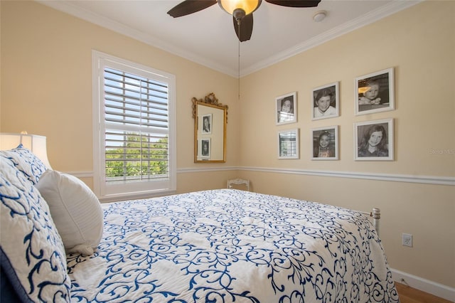 4709 Fox St, Orlando, FL 32814 - bedroom with crown molding, wood finished floors, and a ceiling fan