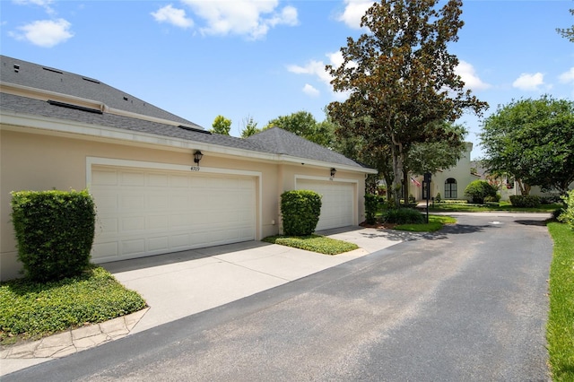 4709 Fox St, Orlando, FL 32814 - garage featuring concrete driveway