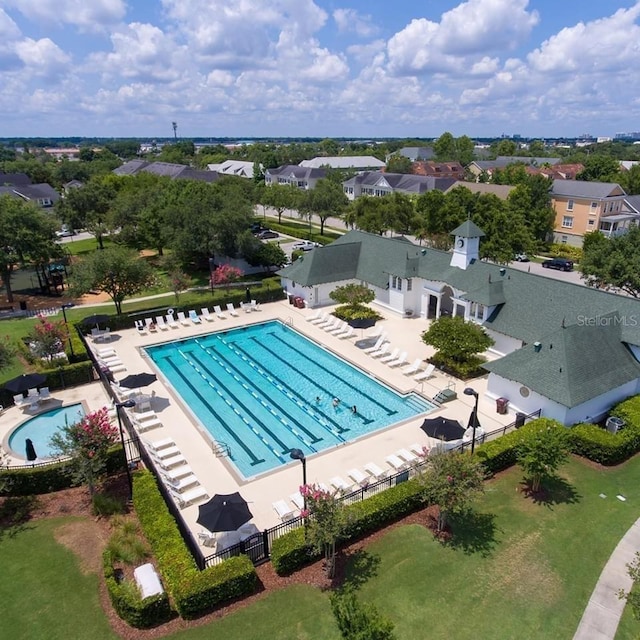 4709 Fox St, Orlando, FL 32814 - community pool with a patio and a residential view