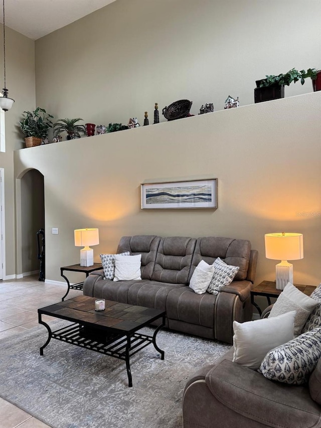5040 Rock Rose Loop, Sanford, FL 32771 - tiled living area with arched walkways