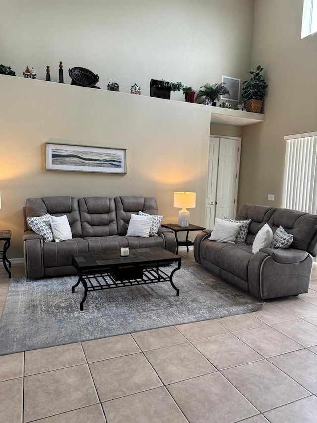5040 Rock Rose Loop, Sanford, FL 32771 - living area with tile patterned floors and a high ceiling