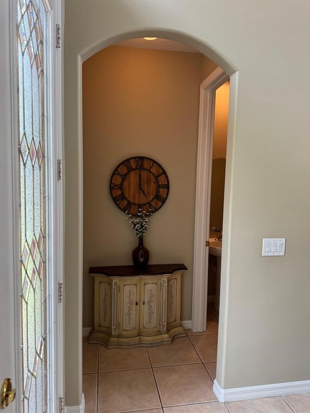 5040 Rock Rose Loop, Sanford, FL 32771 - entrance foyer with arched walkways and light tile patterned flooring