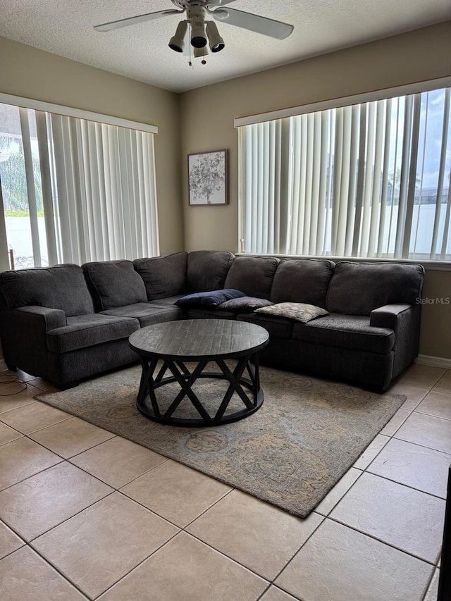 5040 Rock Rose Loop, Sanford, FL 32771 - living room with ceiling fan, light tile patterned floors, and a textured ceiling